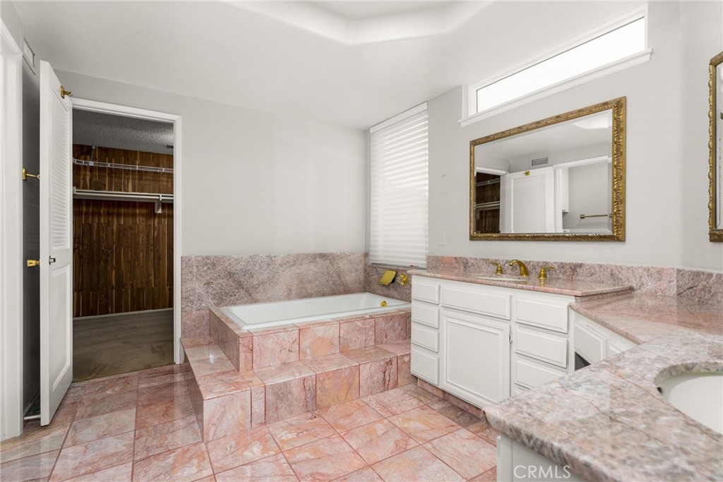 198 Sunflower Street Brea, CA 92821 - Photo 27 of 43 a bathroom with a bathtub sink and mirror