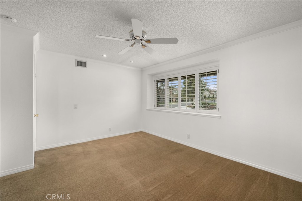 198 Sunflower Street Brea, CA 92821 - Photo 31 of 43 an empty room with windows and fan