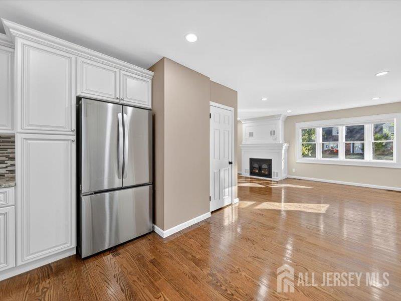 54 Freeman Street Woodbridge, NJ 07095 - Photo 11 of 35 a view of a kitchen with a refrigerator a microwave and a sink