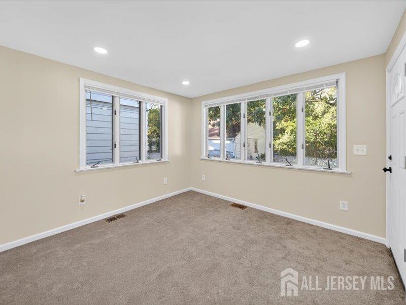 54 Freeman Street Woodbridge, NJ 07095 - Photo 17 of 35 an empty room with windows