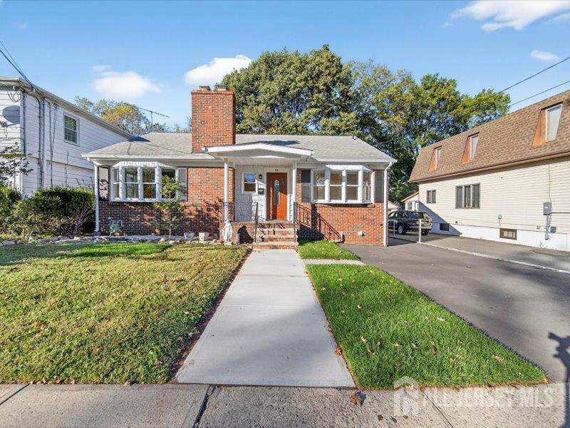 54 Freeman Street Woodbridge, NJ 07095 - Photo 3 of 35 a front view of a house with garden