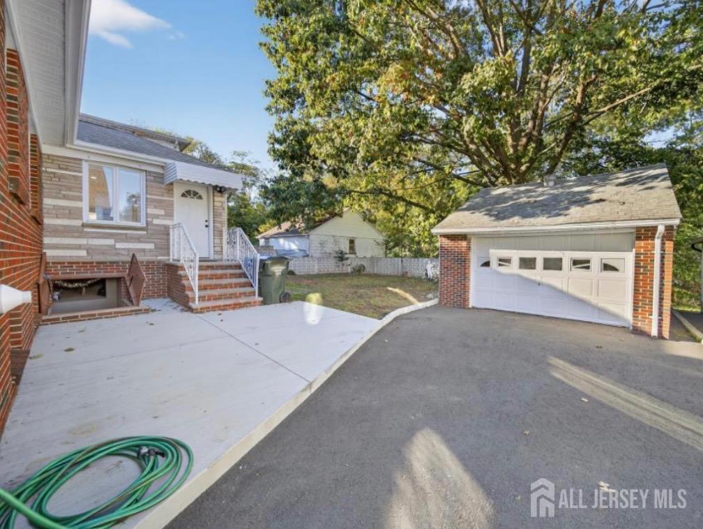 54 Freeman Street Woodbridge, NJ 07095 - Photo 31 of 35 a front view of a house with a yard