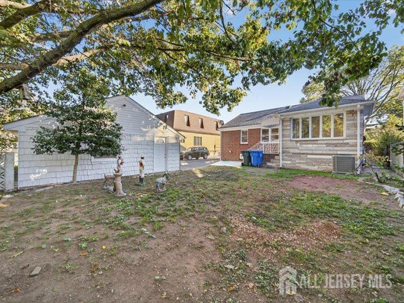 54 Freeman Street Woodbridge, NJ 07095 - Photo 5 of 35 a house view with a backyard space