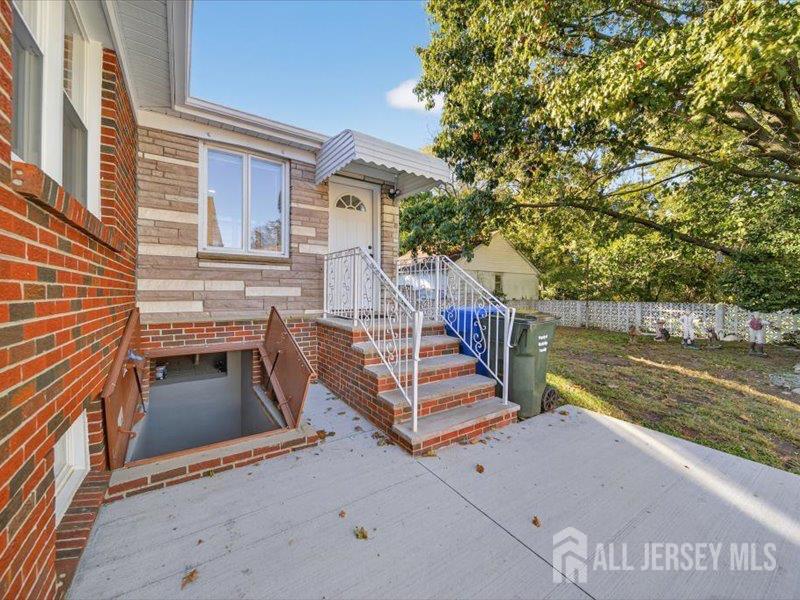 54 Freeman Street Woodbridge, NJ 07095 - Photo 8 of 35 a view of a balcony with two chairs and a stove