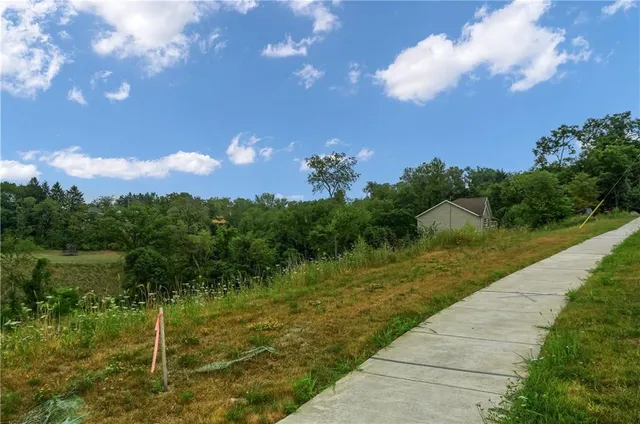 a view of a lake with a yard