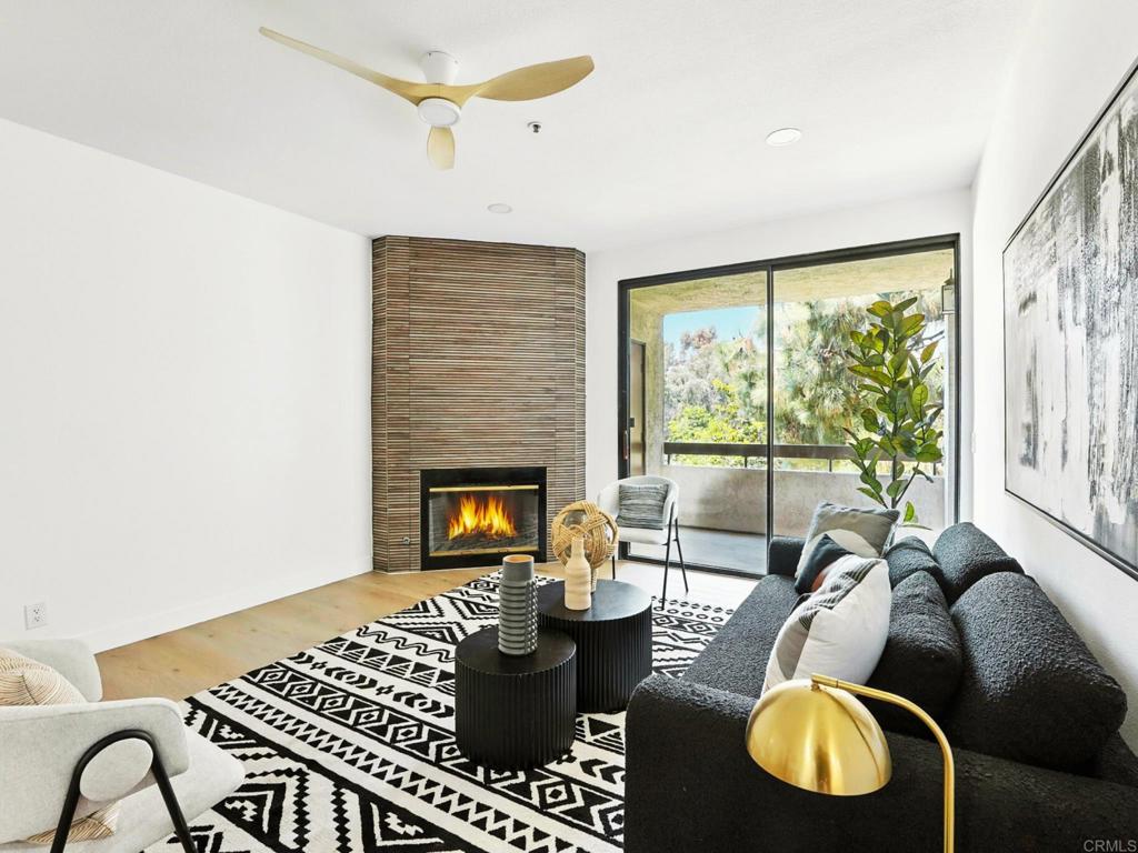 5875 Friars Road, Unit 4307 San Diego, CA 92110 - Photo 2 of 30 a living room with furniture and a fireplace