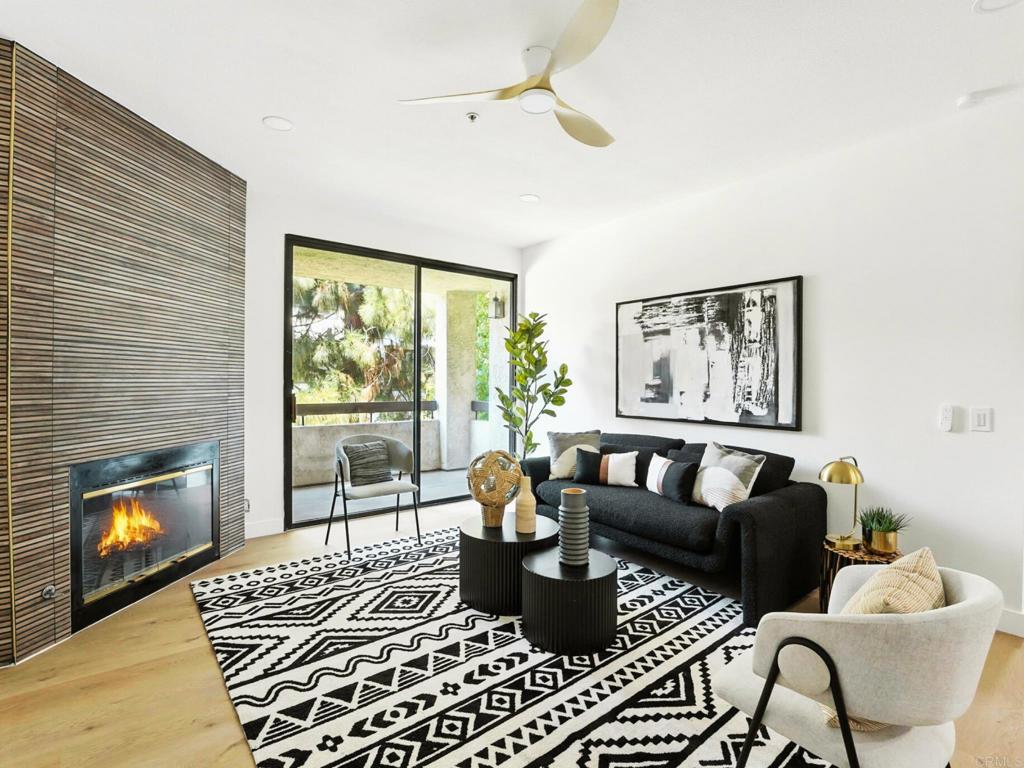 5875 Friars Road, Unit 4307 San Diego, CA 92110 - Photo 3 of 30 a living room with furniture and a fireplace