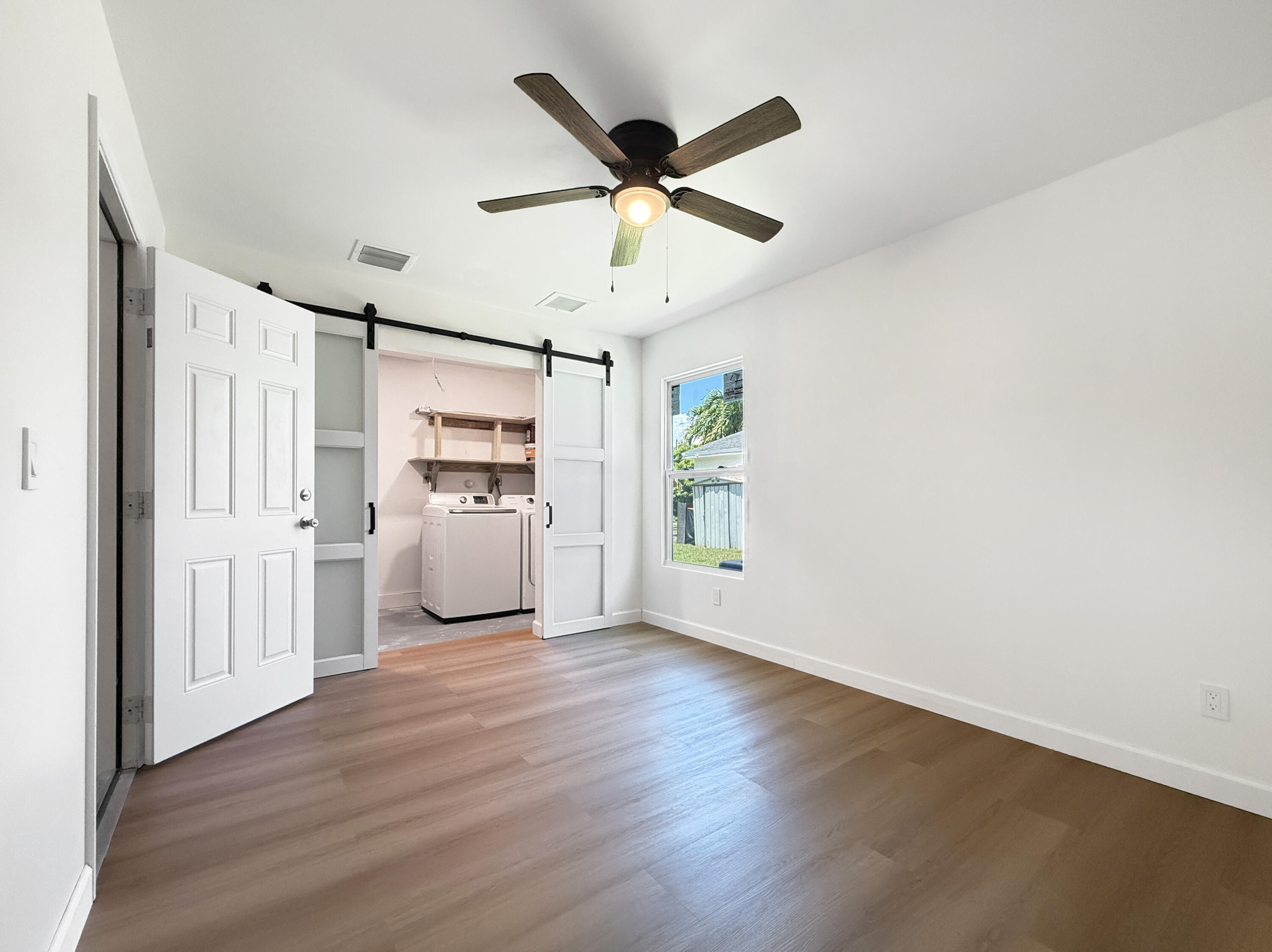 23293 Liberty Bell Terrace Boca Raton, FL 33433 - Photo 16 of 29 3rd Bedroom & Laundry room