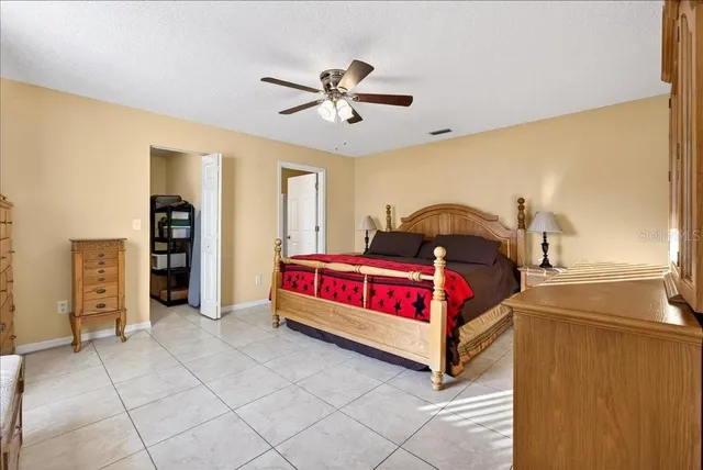 a bed room with a bed and window