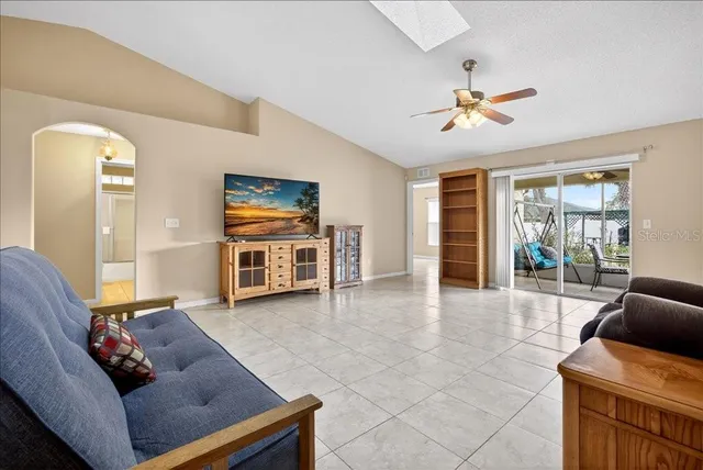 a living room with furniture and a window