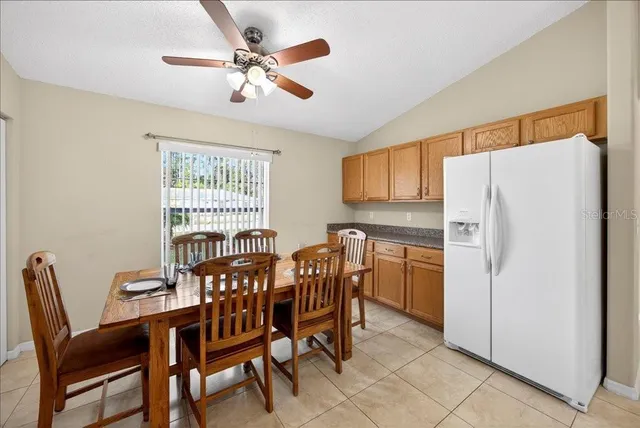 a dining room with furniture and window