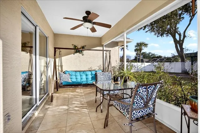 a view of a patio with a table and chairs