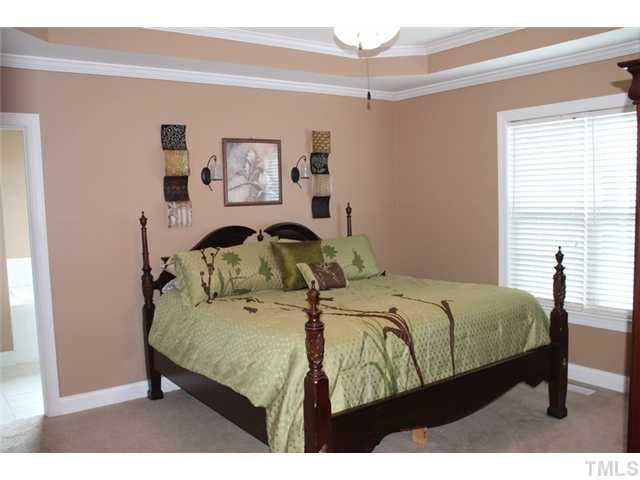 20 Alfred Court Raleigh, NC 27603 - Photo 5 of 7 a bedroom with a bed and window