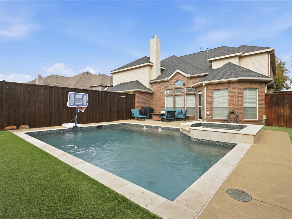 1803 Timber Ridge Drive Frisco, TX 75036 - Photo 2 of 40 View of pool featuring a fenced backyard, a patio area, a pool with connected hot tub, and area for grilling