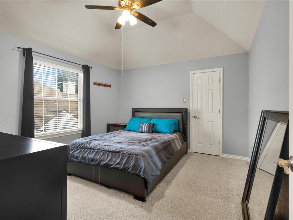 1803 Timber Ridge Drive Frisco, TX 75036 - Photo 28 of 40 Carpeted bedroom featuring a ceiling fan and lofted ceiling