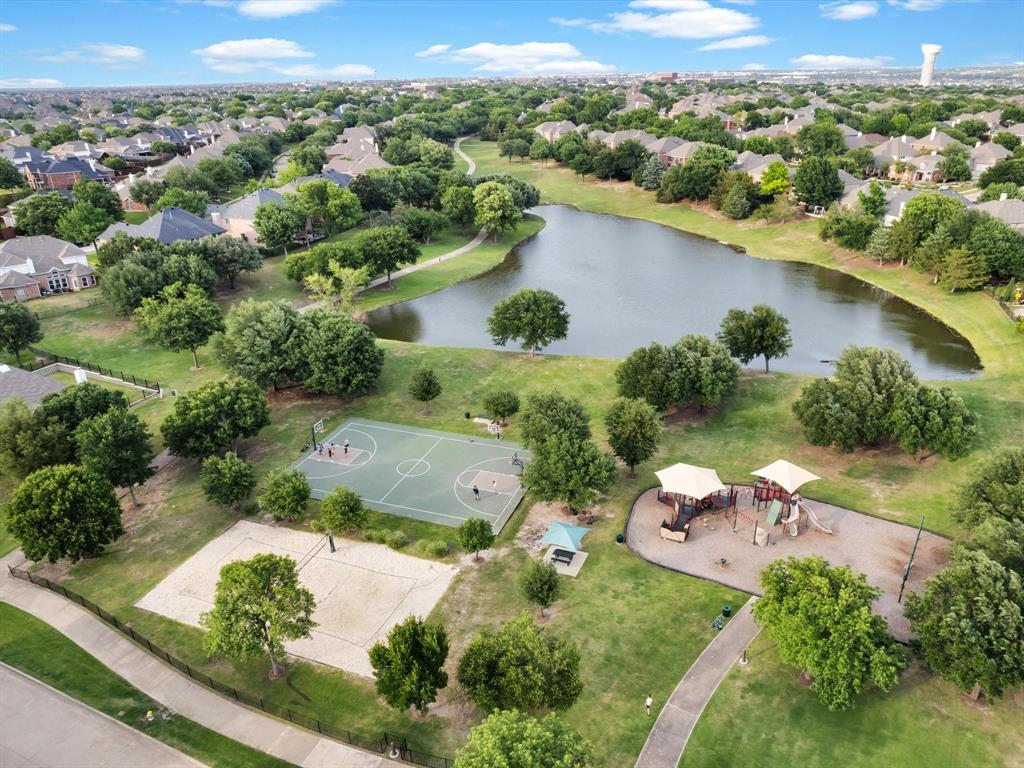1803 Timber Ridge Drive Frisco, TX 75036 - Photo 39 of 40 Aerial view of residential area with a nearby body of water and a tree filled landscape