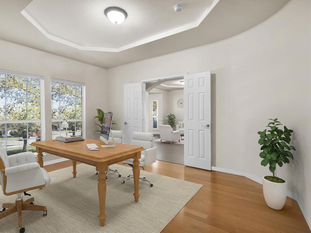 1803 Timber Ridge Drive Frisco, TX 75036 - Photo 6 of 40 Virtually staged Office space featuring wood finished floors, a tray ceiling, and arched walkways