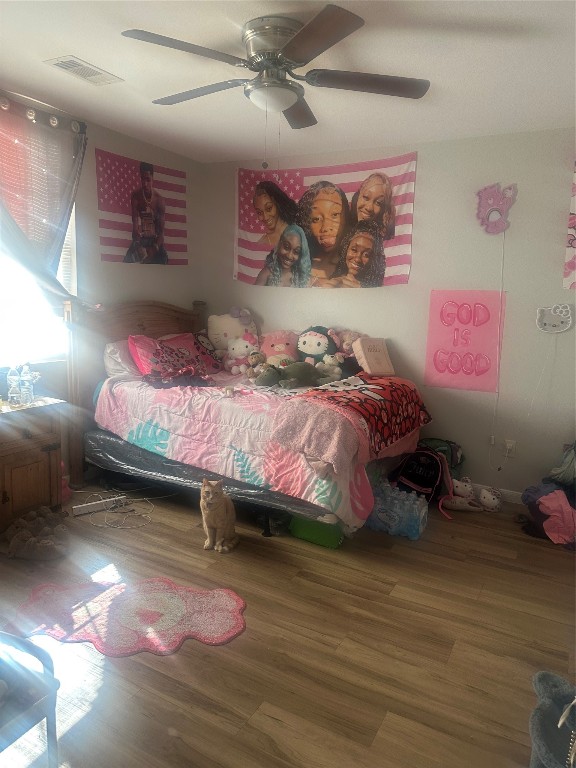 23269 High Point Street, Unit 71 Prairie View, TX 77445 - Photo 15 of 31 a bedroom with a bed and a painting on the wall