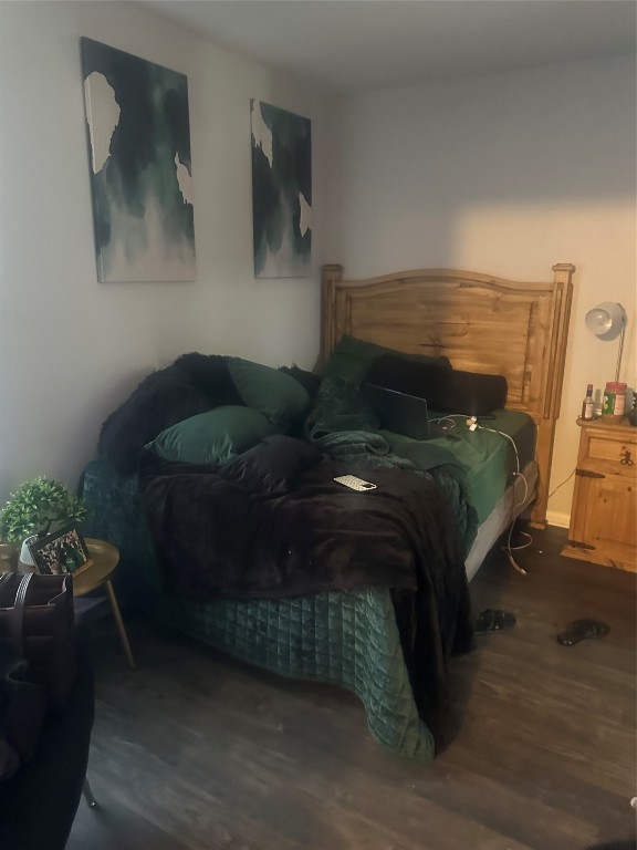 23269 High Point Street, Unit 71 Prairie View, TX 77445 - Photo 18 of 31 a bedroom with a bed potted plant on the table and chair