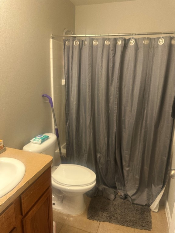 23269 High Point Street, Unit 71 Prairie View, TX 77445 - Photo 24 of 31 a bathroom with a toilet and a shower curtain