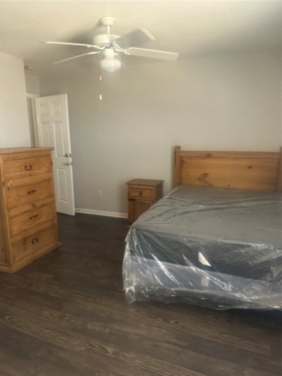 23269 High Point Street, Unit 71 Prairie View, TX 77445 - Photo 26 of 31 a bedroom with a bed and wooden floor