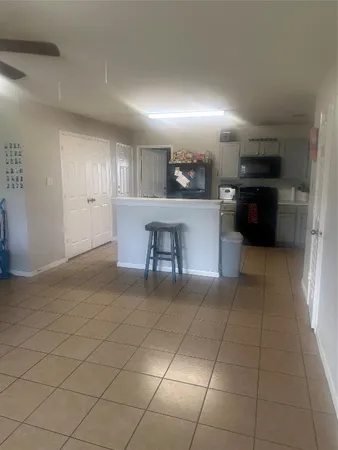 a view of a livingroom with furniture and a window