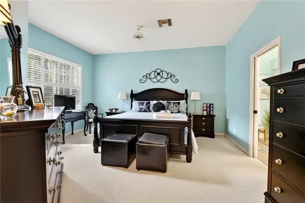 a bedroom with furniture and a window