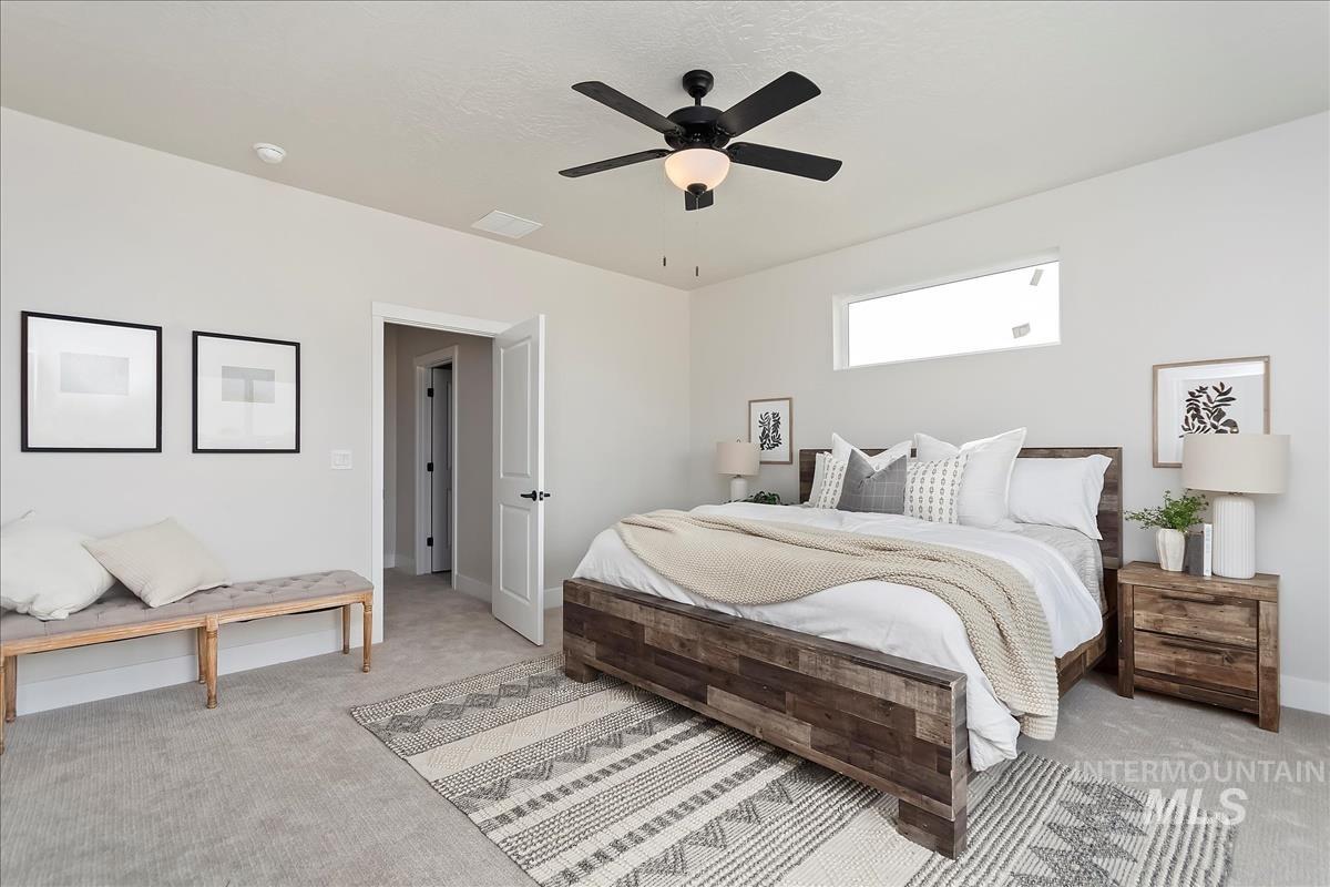 2702 West Gidran Meridian, ID 83642 - Photo 18 of 30 Carpeted bedroom with ceiling fan and baseboards