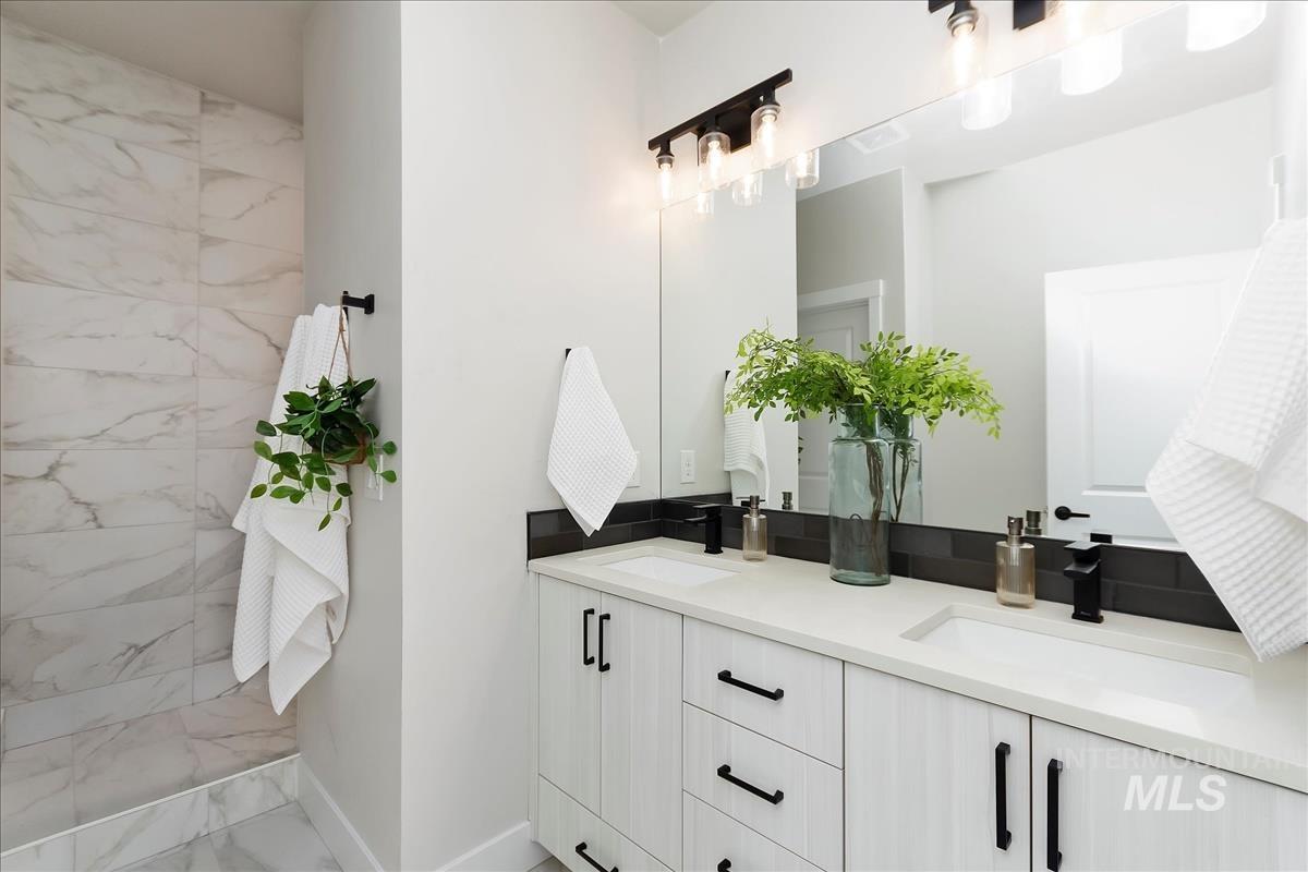 2702 West Gidran Meridian, ID 83642 - Photo 20 of 30 Full bath featuring double vanity and light marble finish flooring