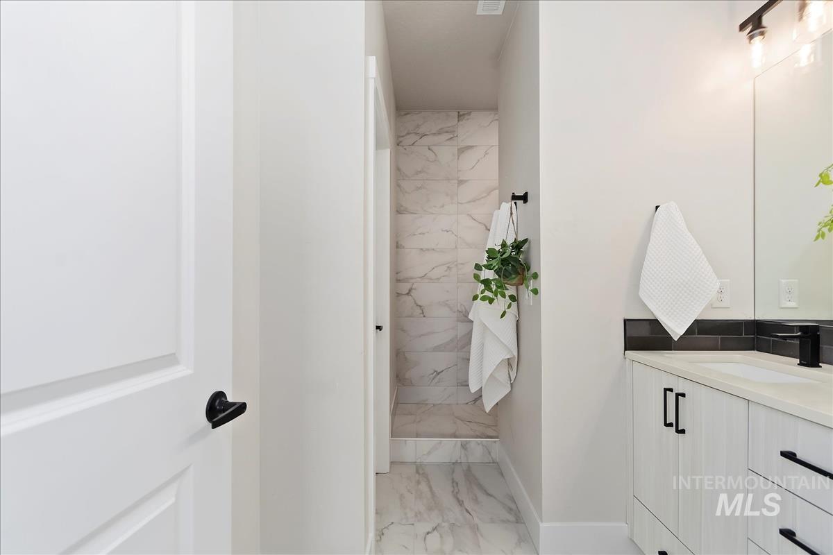 2702 West Gidran Meridian, ID 83642 - Photo 21 of 30 Bathroom with light marble finish floors and vanity