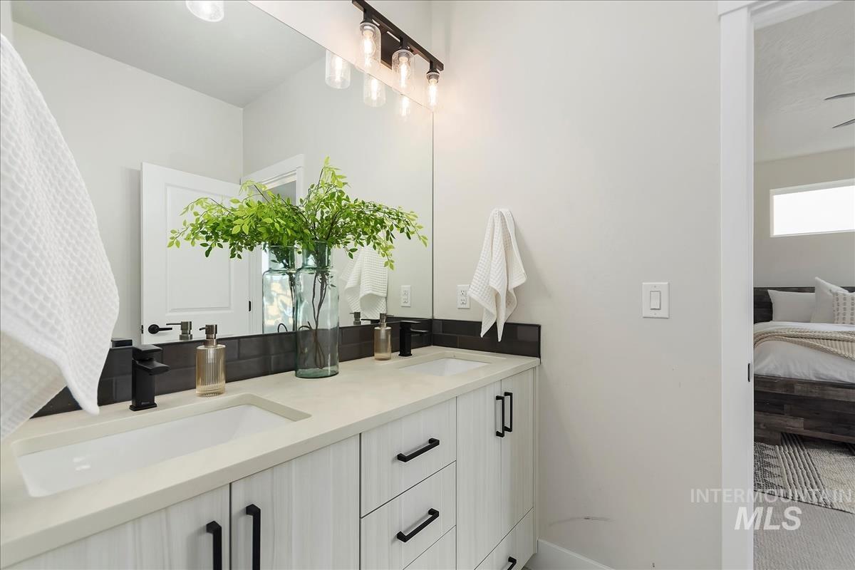 2702 West Gidran Meridian, ID 83642 - Photo 22 of 30 Full bathroom featuring double vanity and connected bathroom