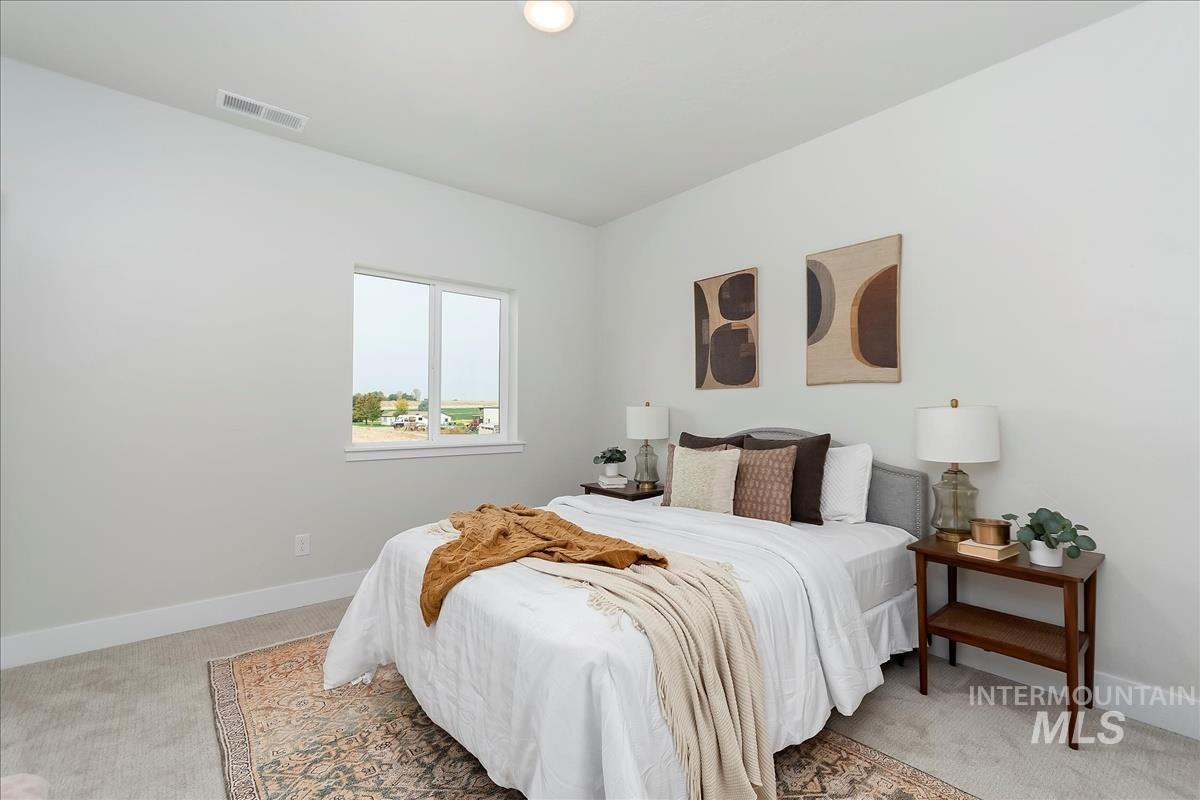 2702 West Gidran Meridian, ID 83642 - Photo 30 of 30 Bedroom with light colored carpet and baseboards