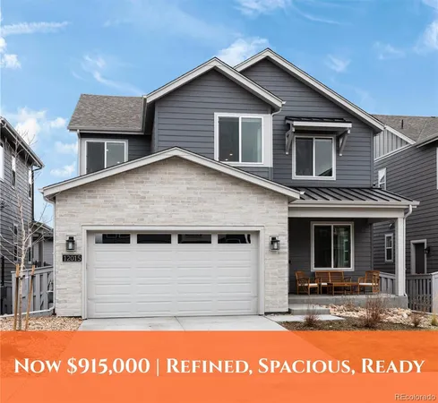 a view of room with walk in closet and wooden floor