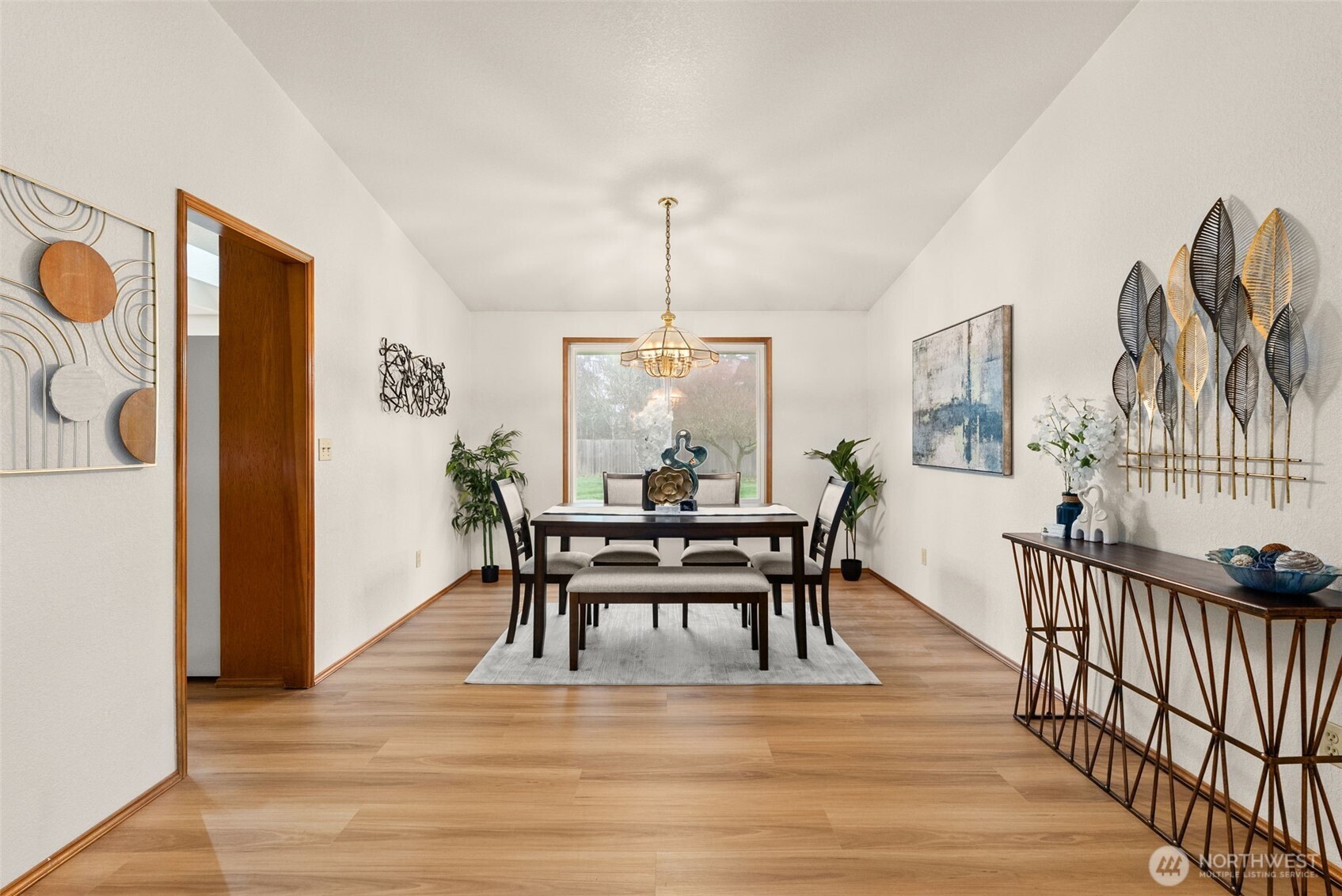 3724 Golden Eagle Loop Southeast Olympia, WA 98513 - Photo 13 of 40 a dining room with furniture a rug and wooden floor