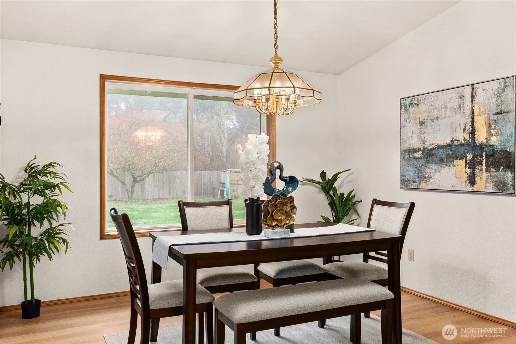 3724 Golden Eagle Loop Southeast Olympia, WA 98513 - Photo 14 of 40 a dining room with furniture a chandelier and wooden floor