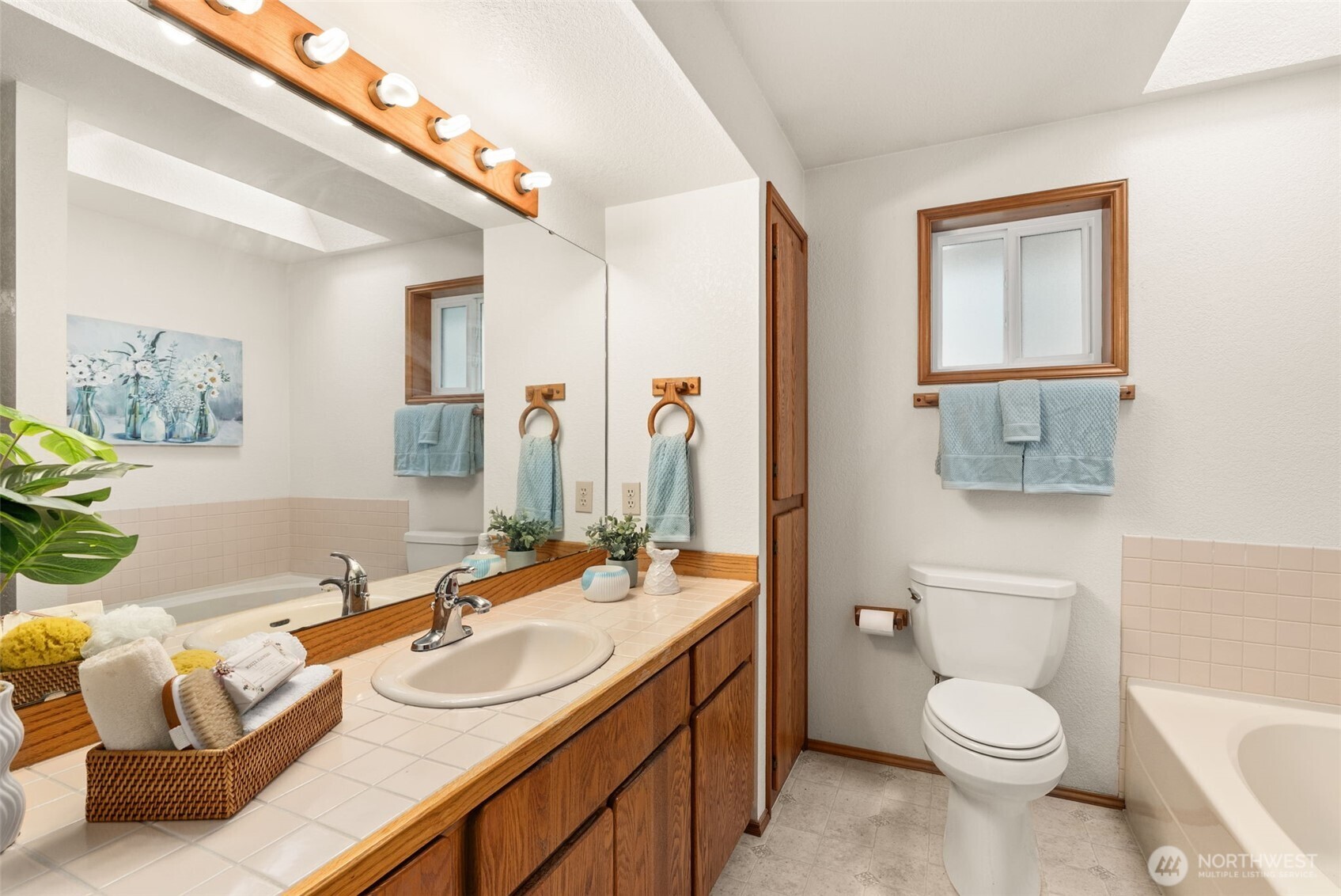 3724 Golden Eagle Loop Southeast Olympia, WA 98513 - Photo 27 of 40 a bathroom with a granite countertop toilet sink and mirror