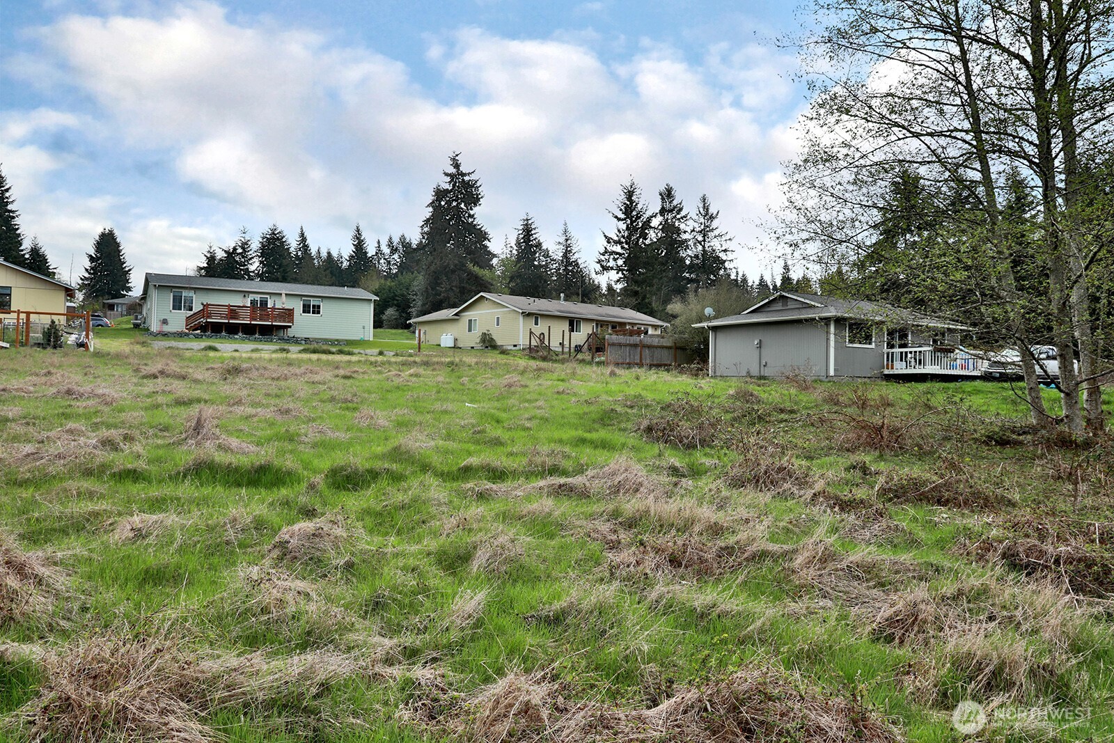 85 Skyview Drive Clinton, WA 98236 - Photo 11 of 26 a view of a big house with a big yard and large trees