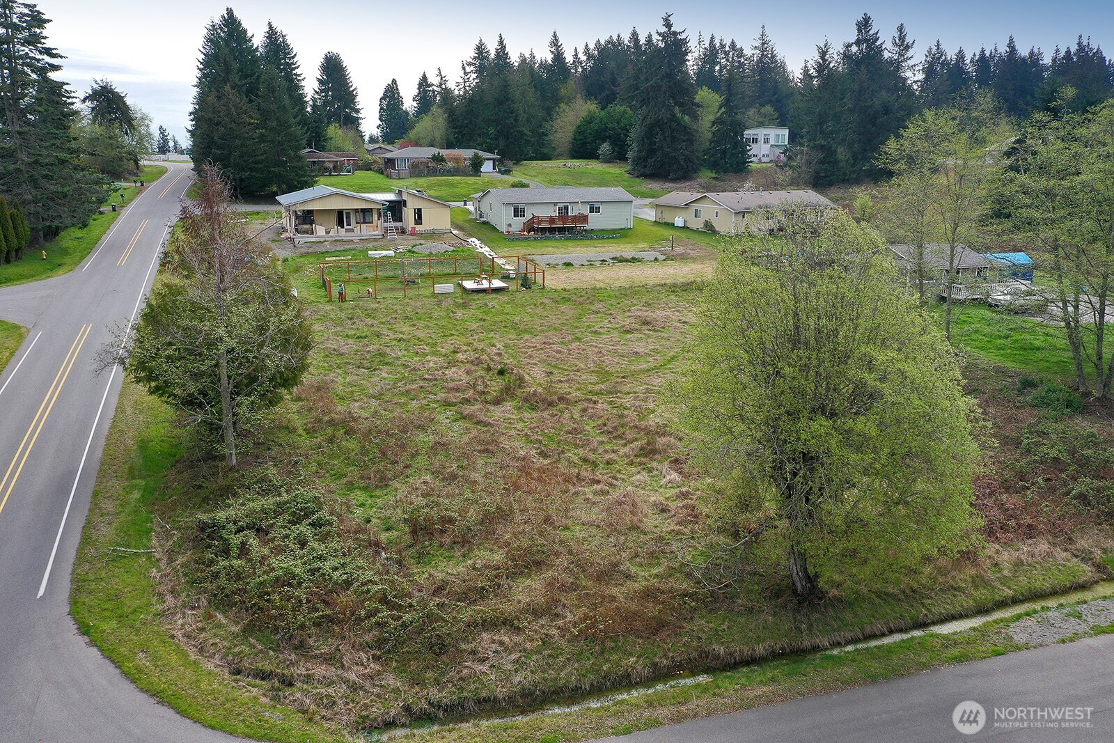 85 Skyview Drive Clinton, WA 98236 - Photo 16 of 26 a view of a swimming pool with a yard