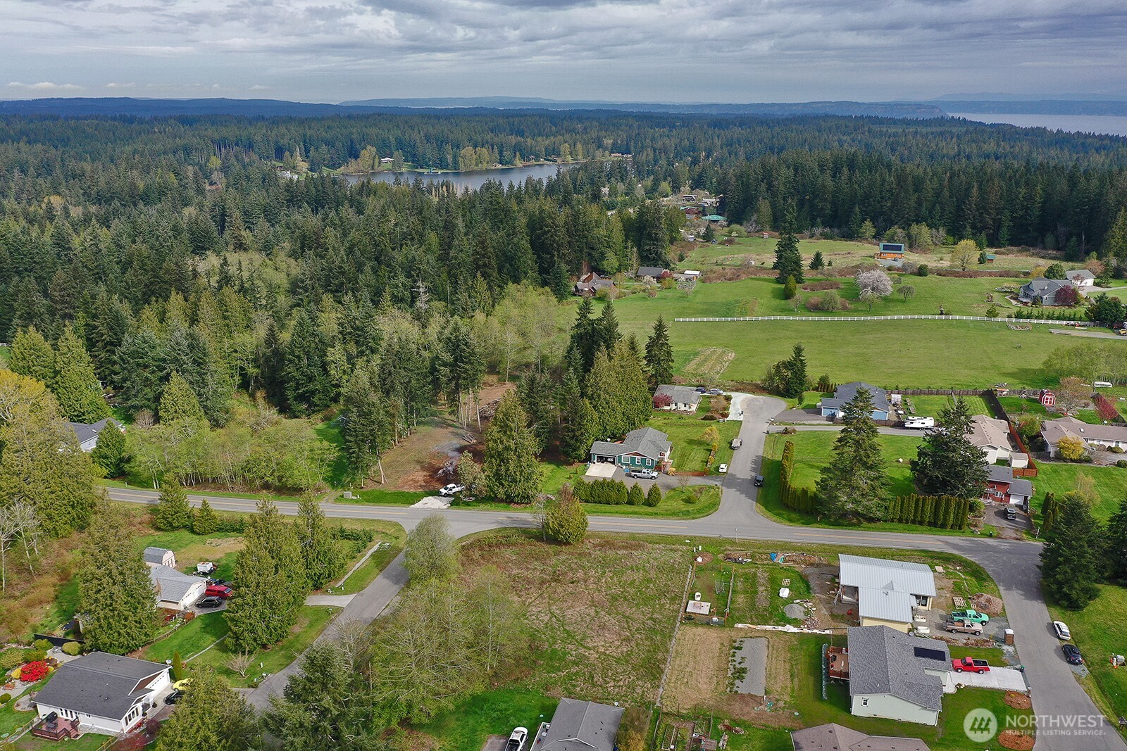 85 Skyview Drive Clinton, WA 98236 - Photo 23 of 26 an aerial view of a house with a yard basket ball court and outdoor seating