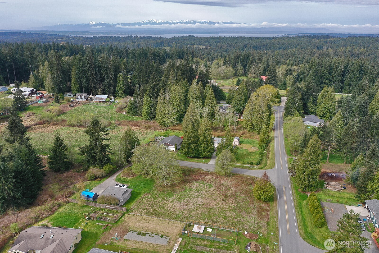 85 Skyview Drive Clinton, WA 98236 - Photo 24 of 26 a view of a city with lush green forest