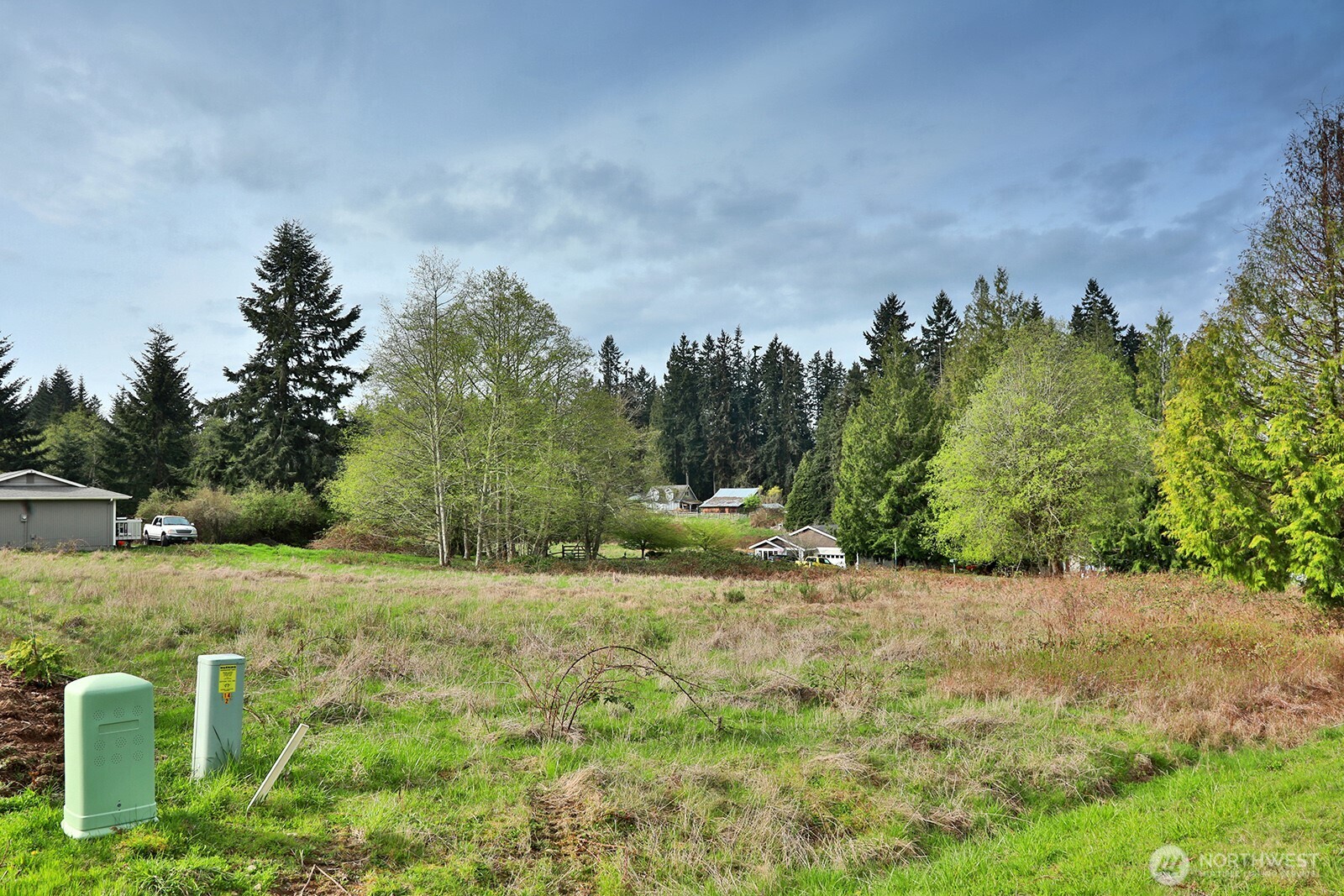 85 Skyview Drive Clinton, WA 98236 - Photo 6 of 26 a view of a field with trees in the background