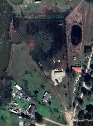 an aerial view of house with yard swimming pool and outdoor seating