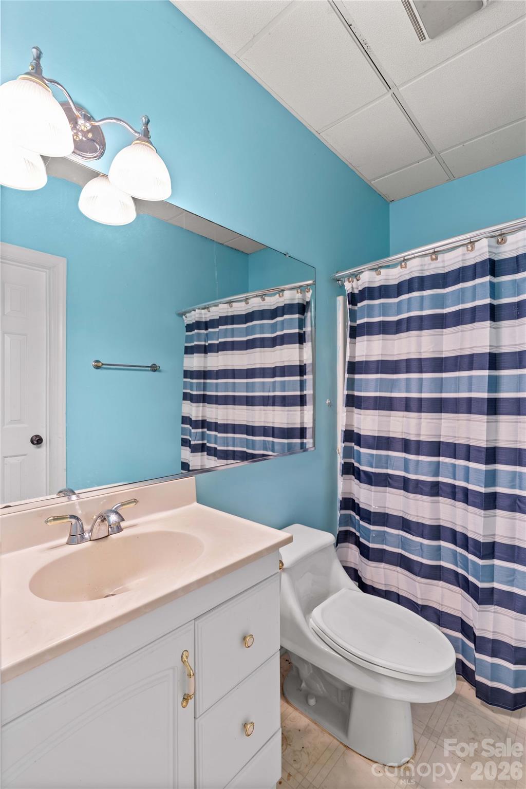 711 Spring Pointe Drive Stony Point, NC 28678 - Photo 27 of 47 a bathroom with a sink a toilet and shower