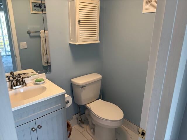 313 Dorset H, Unit 313 Boca Raton, FL 33434 - Photo 12 of 20 a bathroom with a sink and a toilet