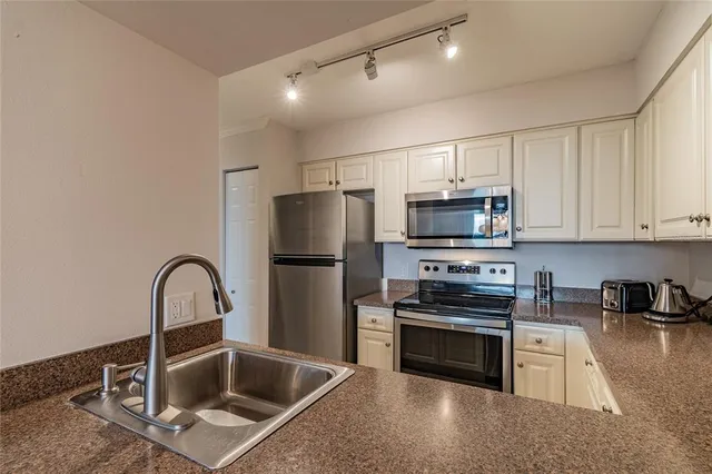 a bed room with a bed and a lamp