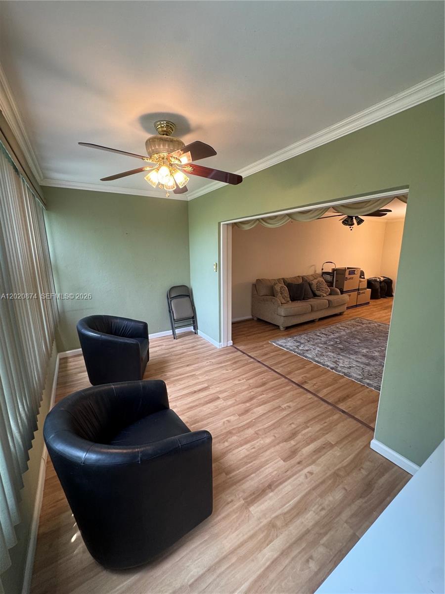 6731 Cypress Road, Unit 410 Plantation, FL 33317 - Photo 15 of 15 a living room with furniture and a chandelier