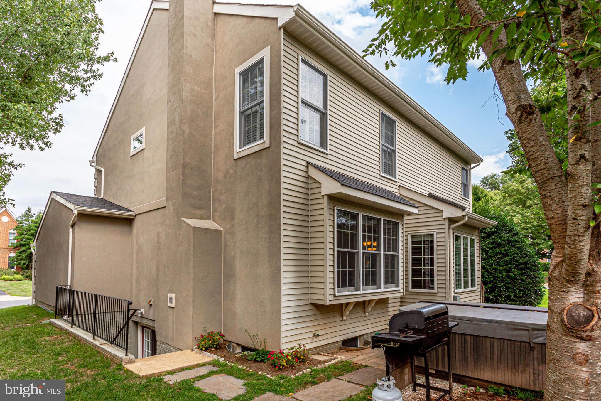 10851 Grovehampton Court Reston, VA 20194 - Photo 46 of 49 a backyard of a house with outdoor seating