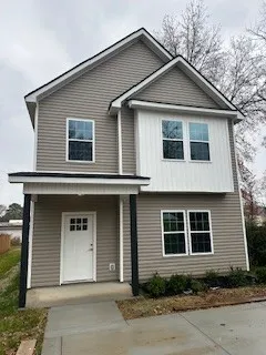 a front view of a house with yard