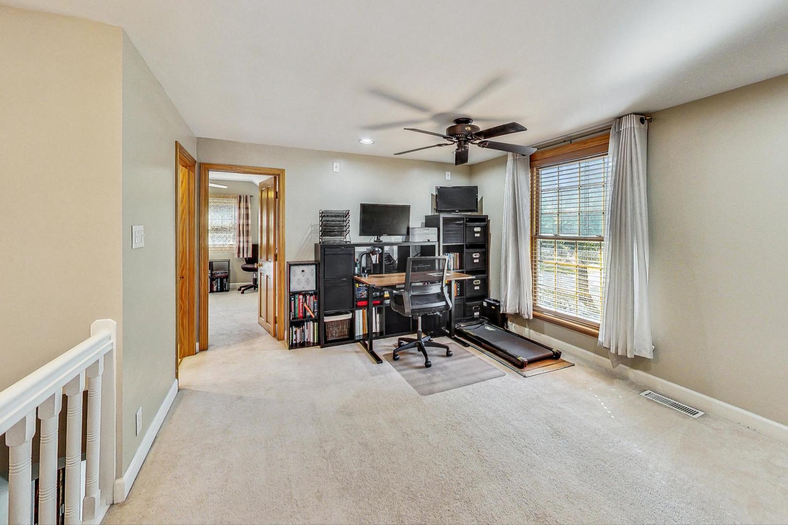 1738 Morse Avenue Des Plaines, IL 60018 - Photo 11 of 31 a view of a livingroom with workspace and windows