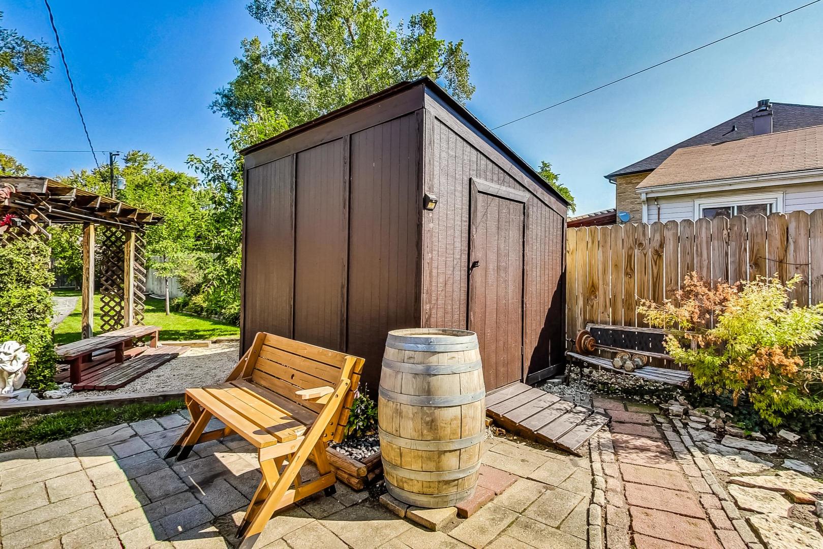 1738 Morse Avenue Des Plaines, IL 60018 - Photo 24 of 31 a backyard of a house with yard and outdoor seating